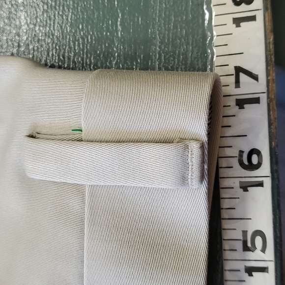 DOCKERS KHAKI SLACKS, Size 34 X 30, pleated front. Side pockets 2 button pockets - Picture 9 of 11